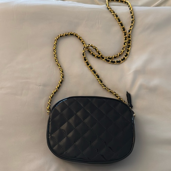 Jennifer Moore Handbags - Quilted patent leather handbag with gold chain to elevate any look.